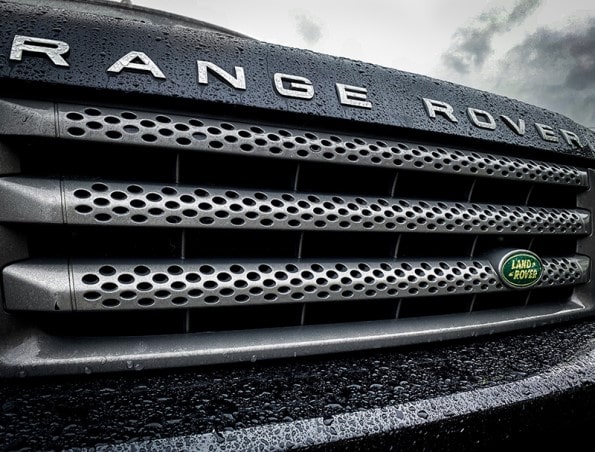 Land Rover Range Rover Badge on Luxury SUV Front Grille in Rain